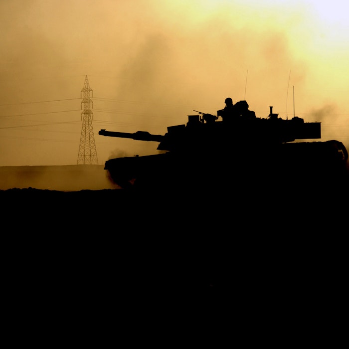 A US Army (USA) M1 Abrams Main Battle Tank (MBT), Apache Troop, 2nd Battalion, 7th Cavalry Regiment (2-7 CAV), 2nd Brigade Combat Team (BCT), 1ST Cavalry Division (CAV DIV), returns to battle within the city after refueling and reloading during major combat operation in Fallujah during Operation IRAQI FREEDOM A US Army (USA) M1 Abrams Main Battle Tank (MBT), Apache Troop, 2nd Battalion, 7th Cavalry Regiment (2-7 CAV), 2nd Brigade Combat Team (BCT), 1ST Cavalry Division (CAV DIV), returns to battle within the city after refueling and reloading during major combat operation in Fallujah during Operation IRAQI FREEDOM