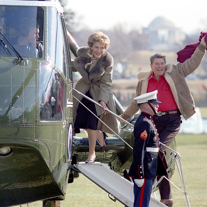 President Ronald Reagan Holding a T Shirt and Nancy Reagan During Their Departure Via Marine One for Camp David on The South Lawn President Ronald Reagan Holding a T Shirt and Nancy Reagan During Their Departure Via Marine One for Camp David on The South Lawn