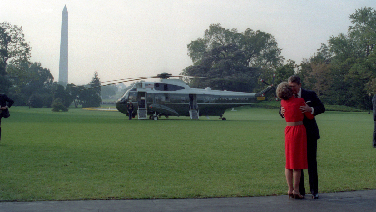 Nancy and Ronnie hugging on lawn