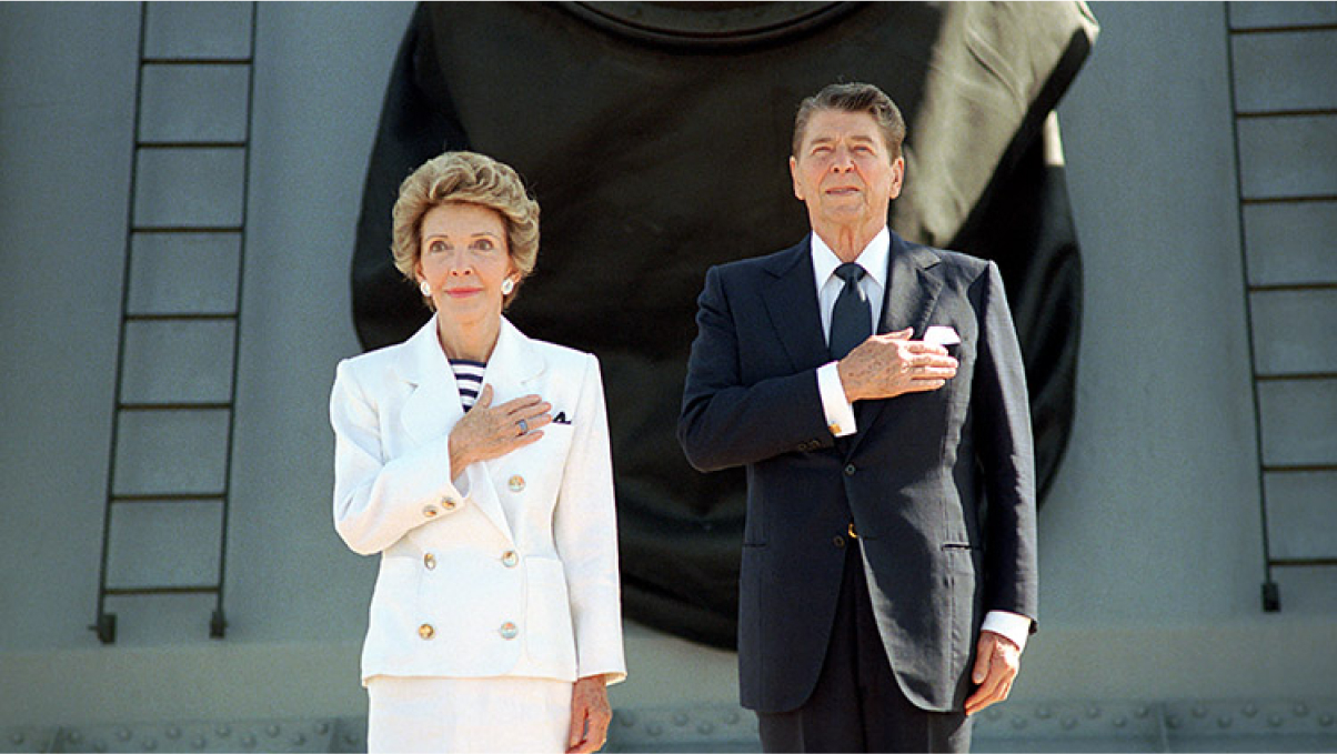 Nancy and Ronnie pledge allegiance to the flag