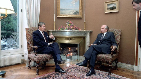 Reagan and Gorbachev talking near fireplace. Reagan and Gorbachev talking near fireplace.