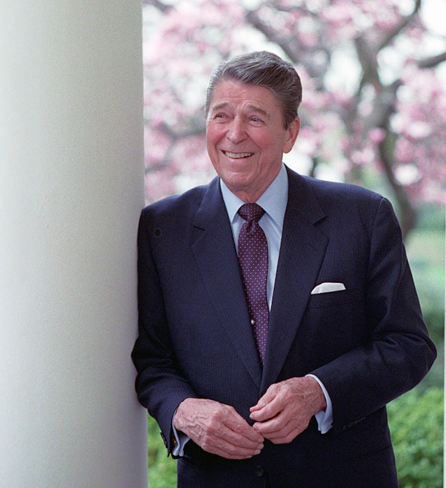 Official Reagan Portrait In The Rose Garden President Reagan smiling and leaning against a pillar