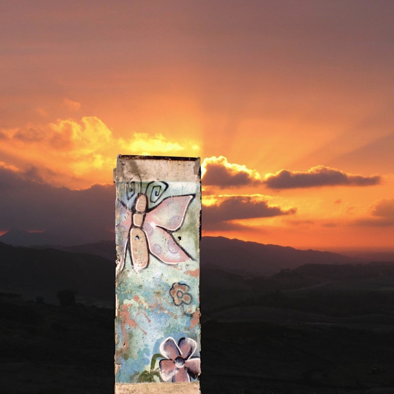 A piece of the Berlin Wall at Sunset A piece of the Berlin Wall at Sunset