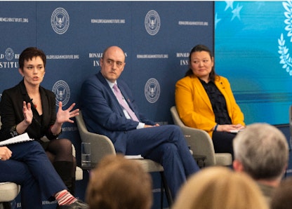 People speaking on stage People speaking on stage