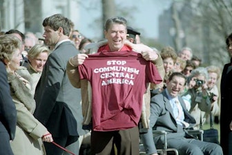 President Reagan holding a stop communism central america shirt President Reagan holding a stop communism central america shirt
