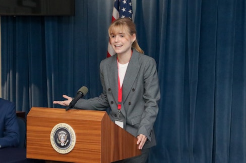 Debate Championship 2023 Female Student at Presidential Podium
