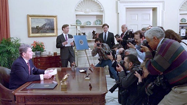 Ronald Reagan sitting, Resolute desk in Oval Office