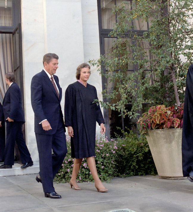 President Reagan and Justice Sandra Day O'Connor outside the Supreme Court after her swearing-in ceremony. 09/25/1981. President Reagan and Justice Sandra Day O'Connor walking outside