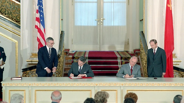 Reagan and Gorbachev Signing INF Treaty Two men in the Kremlin signing papers at a massive desk