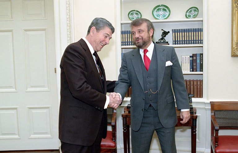 1/13/1989 President Reagan during a photo op. with Tony Dolan in the Oval Office
