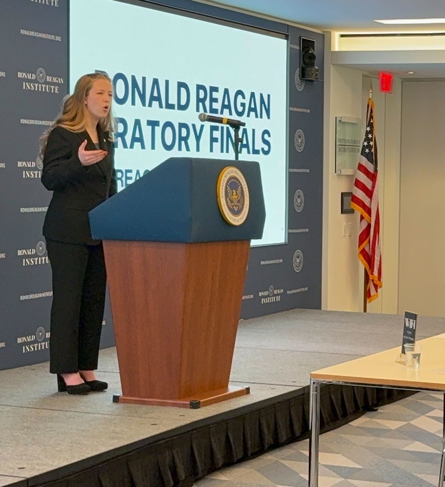 Oratory Finals 2024 Female Student at Presidential Podium