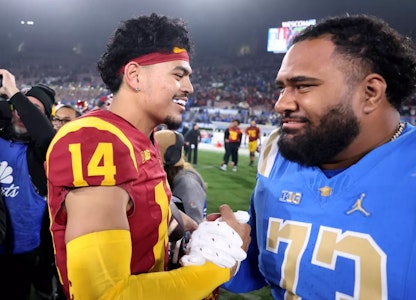 USC quarterback Jayden Maiava is congratulated by UCLA offensive lineman Alani Makihele after the rivals’ game at the Rose Bowl on Nov. 23. (Wally Skalij / Los Angeles Times)