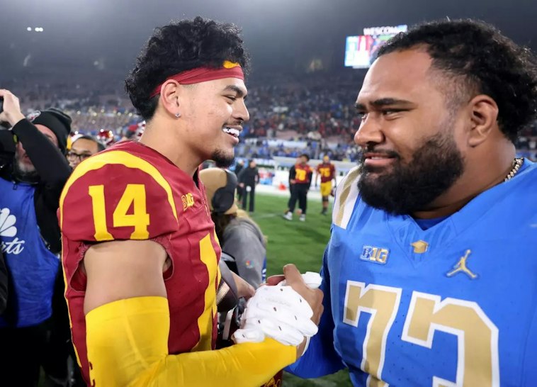 USC quarterback Jayden Maiava is congratulated by UCLA offensive lineman Alani Makihele after the rivals’ game at the Rose Bowl on Nov. 23. (Wally Skalij / Los Angeles Times)