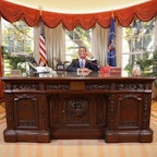 Student sitting behind the Resolute Desk in the Oval Office replica at the Reagan Library Student sitting behind the Resolute Desk in the Oval Office replica at the Reagan Library