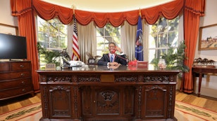 Student sitting behind the Resolute Desk in the Oval Office replica at the Reagan Library Student sitting behind the Resolute Desk in the Oval Office replica at the Reagan Library