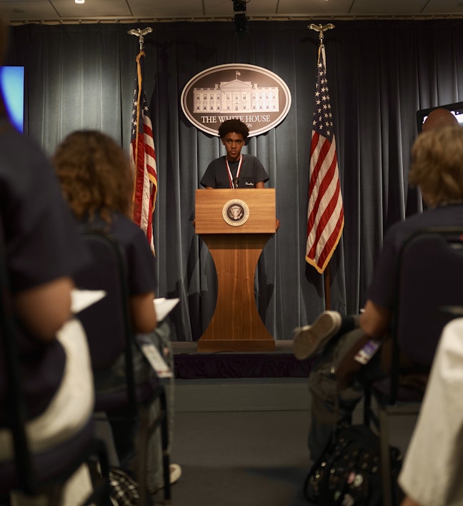RLC Press Room Male Student at Presidential Podium