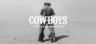 A lone cowboy stands looking at the horizon