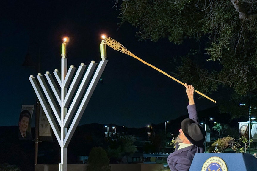 Person lighting the Menorah