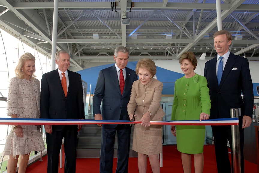 Nancy Reagan cut the ribbon to officially open the Air Force One Pavilion at the Ronald Reagan Library on October 21, 2005. President George W. Bush and First Lady Laura Bush joined her for the ceremony. Nancy Reagan cut the ribbon to officially open the Air Force One Pavilion at the Ronald Reagan Library on October 21, 2005. President George W. Bush and First Lady Laura Bush joined her for the ceremony.