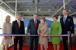 Nancy Reagan cut the ribbon to officially open the Air Force One Pavilion at the Ronald Reagan Library on October 21, 2005. President George W. Bush and First Lady Laura Bush joined her for the ceremony.
