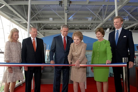 Nancy Reagan cut the ribbon to officially open the Air Force One Pavilion at the Ronald Reagan Library on October 21, 2005. President George W. Bush and First Lady Laura Bush joined her for the ceremony.