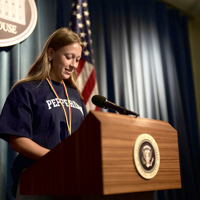 Student at Podium Female Student at Podium