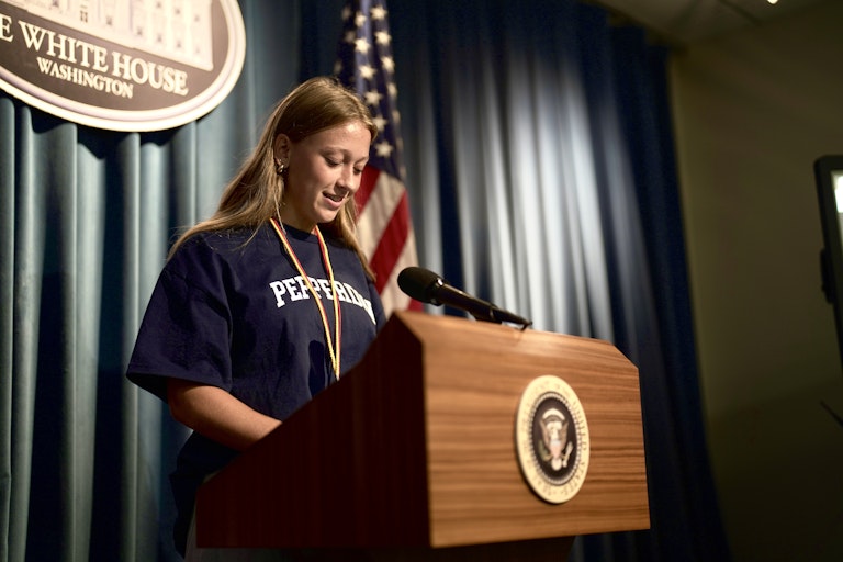 Female Student at Podium