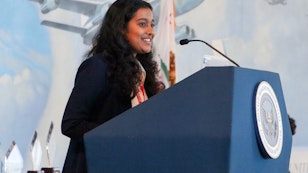 Person speakign on a podium.