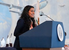 Person speakign on a podium.