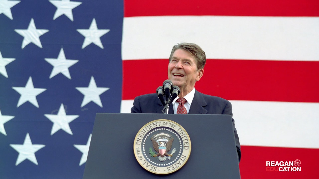 Ronald Reagan Speaking at podium in front of American flag