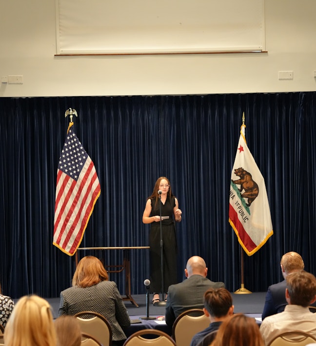 Civics Bee Student Female Student Speaking at Microphone