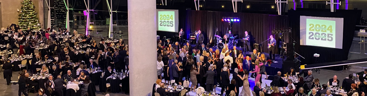 guest dancing and dining around the stage