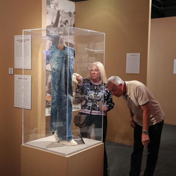 Guests looking at the exhibit pieces