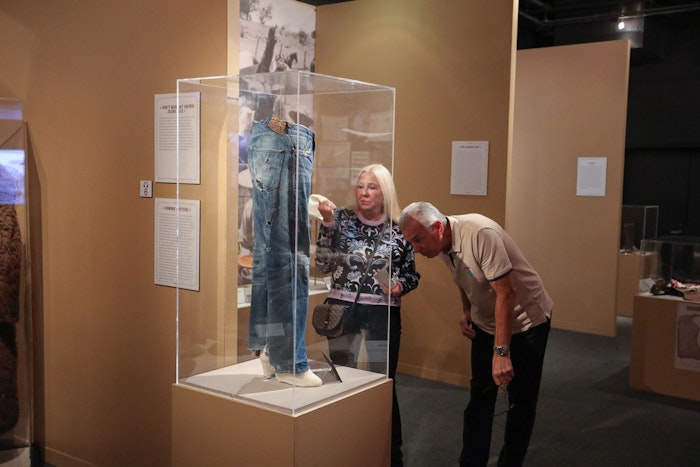Guests looking at the exhibit pieces