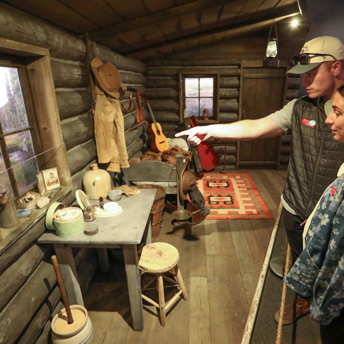 Guests looking at the exhibit pieces
