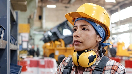 Young woman in yellow hard hat