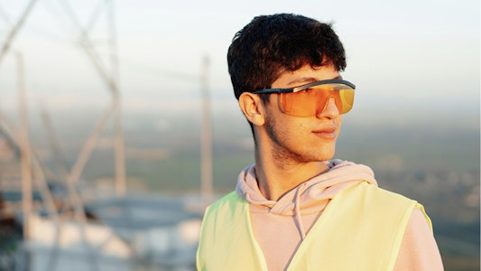 Young student in safety glasses