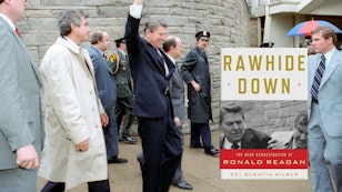 President Reagan waving to a crowd, on the day of the assasination attempt