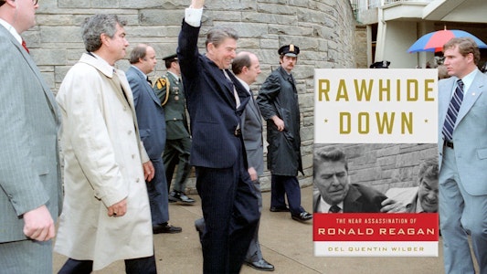 President Reagan waving to a crowd, on the day of the assasination attempt