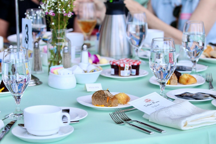 Table set for Tea. Desserts, breads , and jelly.