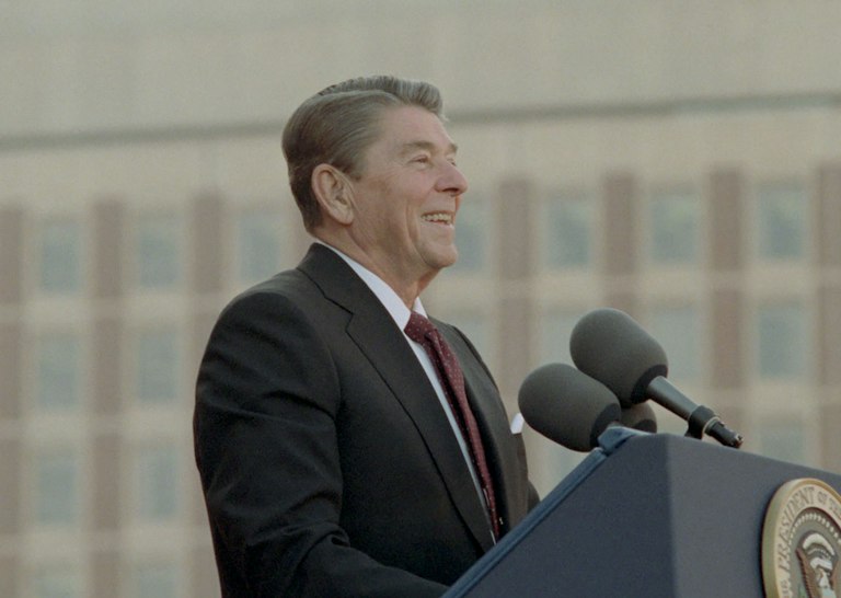 President Reagan standing at the podium during a trip to Boston Massachusetts at a Reagan Bush Rally at the City Hall Plaza President Reagan standing at the podium during a trip to Boston Massachusetts at a Reagan Bush Rally at the City Hall Plaza