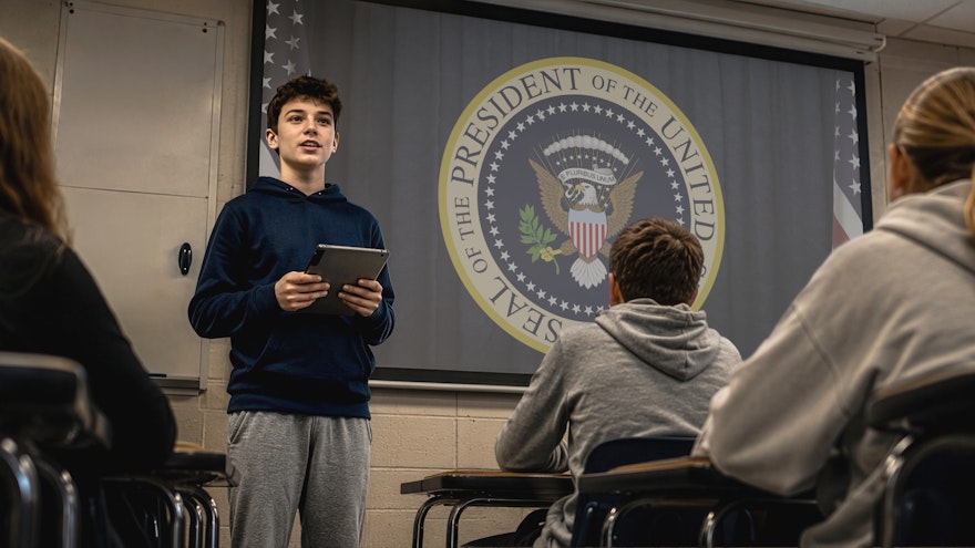 Student presenting in front of the class