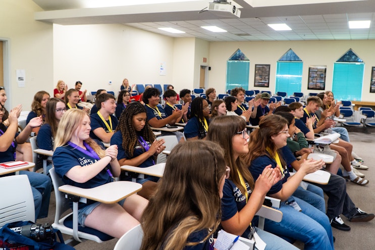 students clapping in classroom