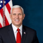 Vice President Mike Pence with book cover of What Conservatives Believe Vice President Mike Pence with book cover of What Conservatives Believe
