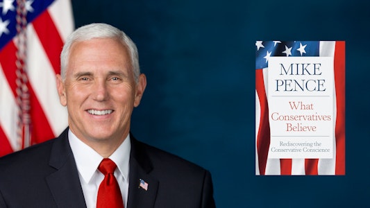 Vice President Mike Pence with book cover of What Conservatives Believe Vice President Mike Pence with book cover of What Conservatives Believe