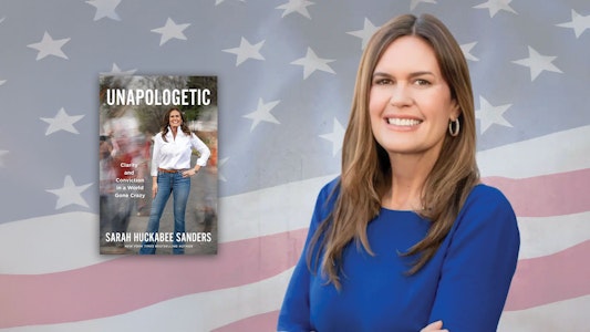 Governor Sarah Huckabee Sanders with book cover "Unapologetic"