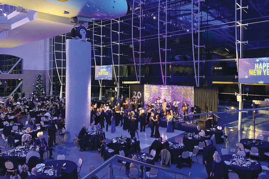elegant evening featuring a gourmet dinner, a midnight champagne toast, and a festive array of party favors—including hats, horns, streamers, and more.